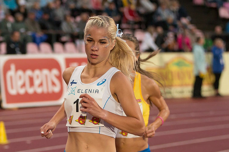 Finnish distance runner, Alisa Vainio running on a track.