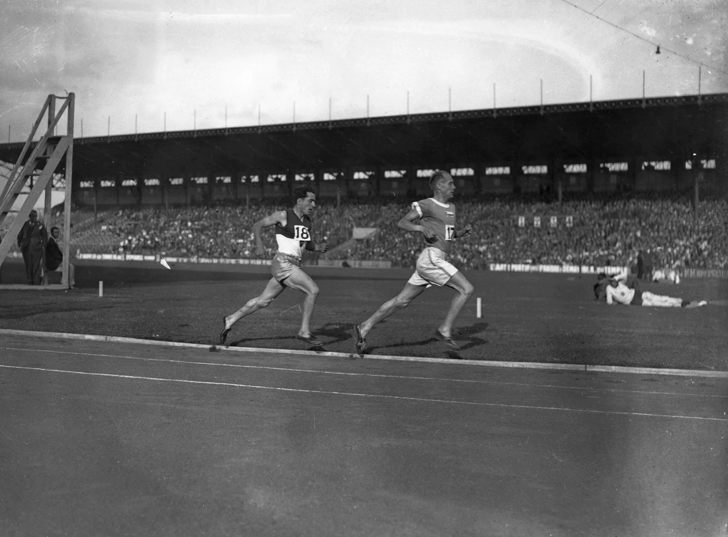 Former Finnish distance runner, Paavo Nurmi, racing on a track.