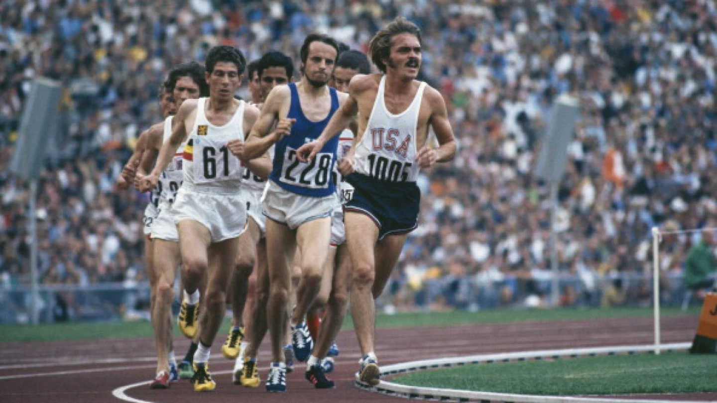 Professional United States runner, Steve Prefontaine, leading a 5000 meter track race in Oregon, California, with Lasse Viren of Finland close behind.