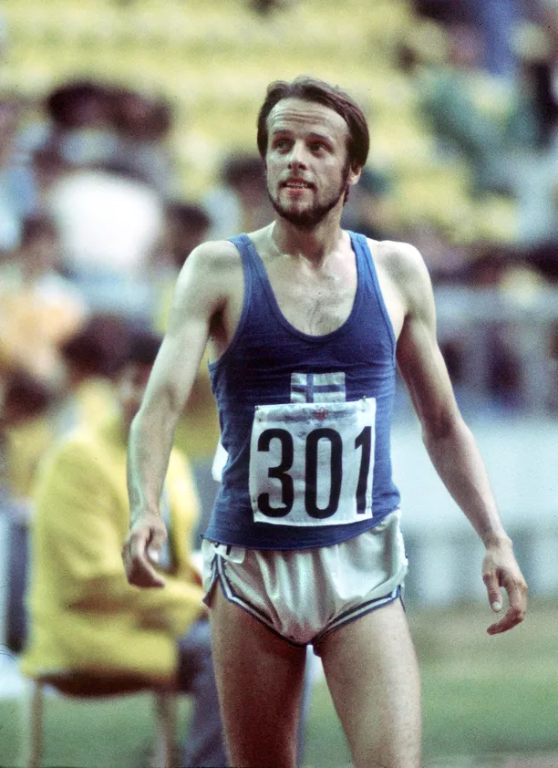 Finnish runner, Lasse Viren, standing.