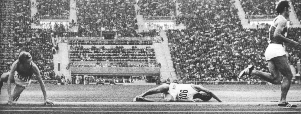 Finnish runner, Lasse Viren, fallen on the track.